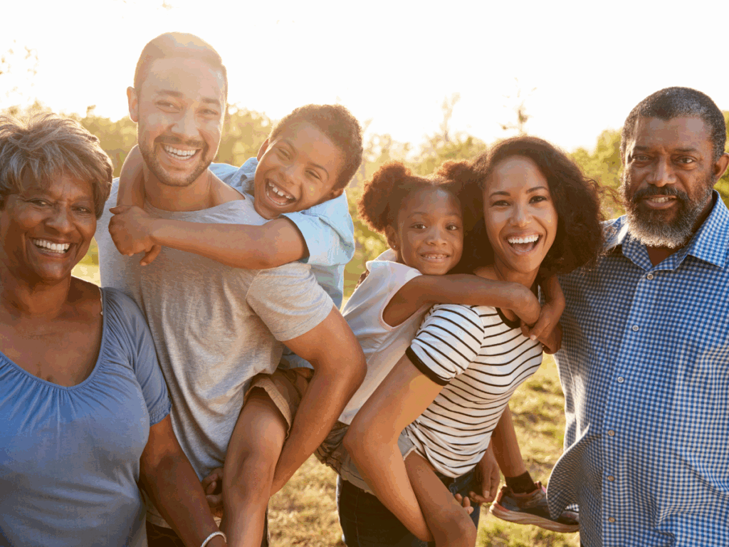 A smiling family enjoying quality time together, representing the power of printable activities for kids to reduce screen time and encourage social connection through fun games for all ages.