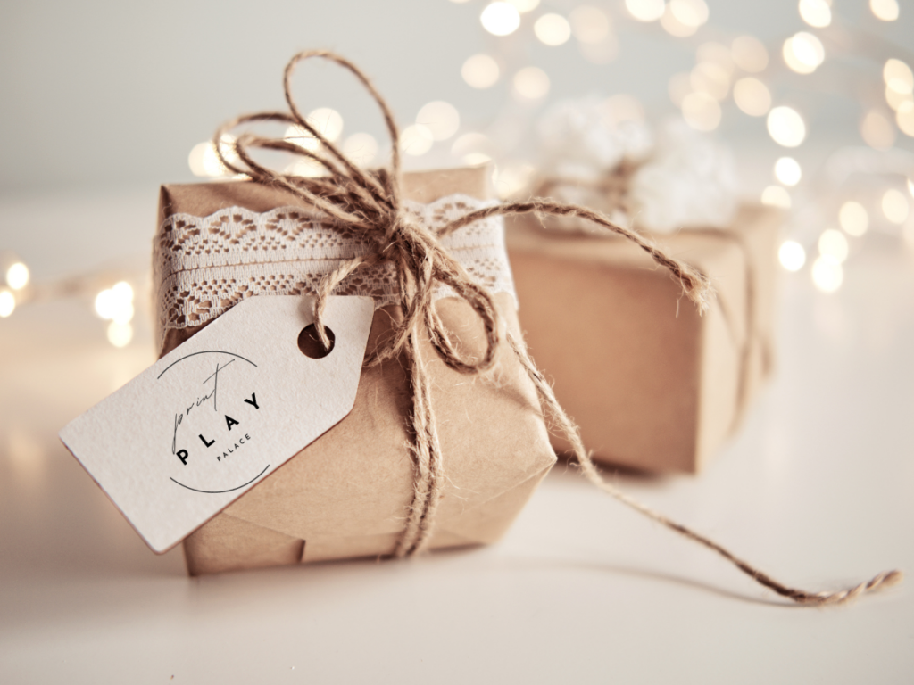 Beautifully wrapped gift with a PrintPlayPalace tag, symbolizing the joy of giving and the easy access to free printable games for screen-free fun.