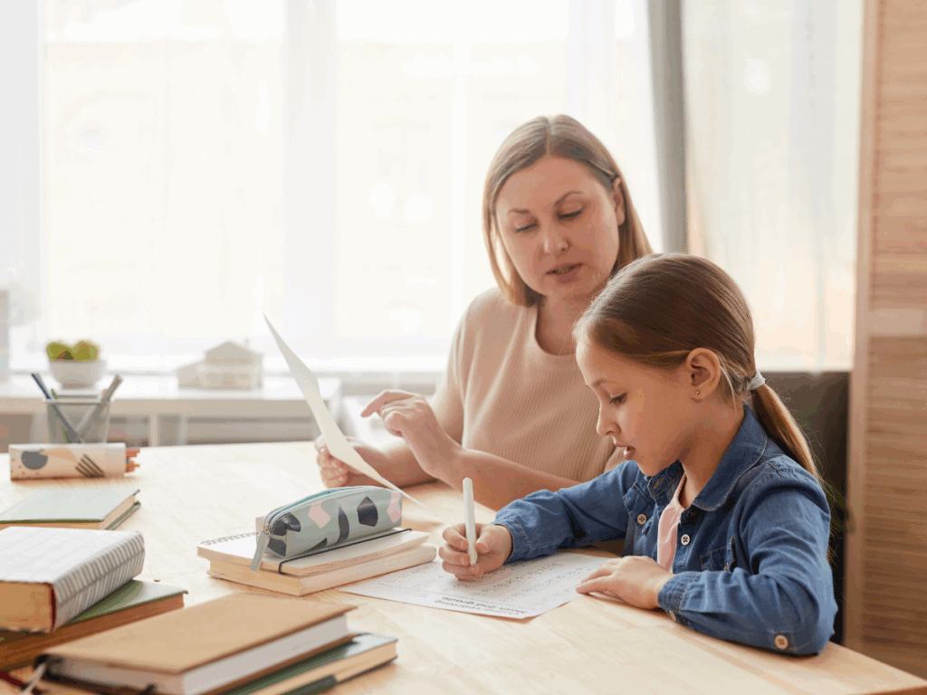 A mother helping her daughter with a printed activity sheet, demonstrating how games can be both fun and educational at home.