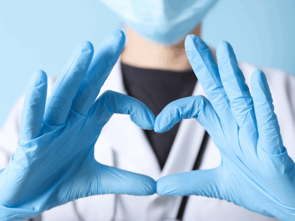 Nurse making heart shape with her hands