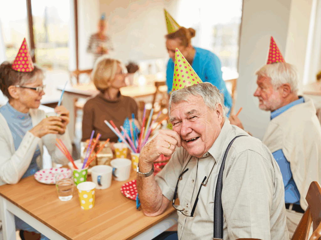 Happy Seniors together celebrating in the living room